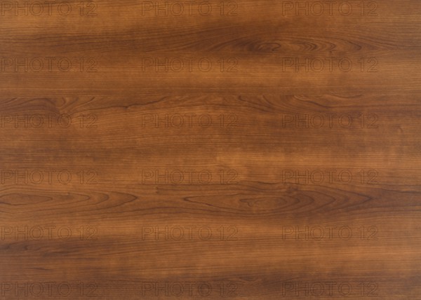 A full frame brown wood grain surface