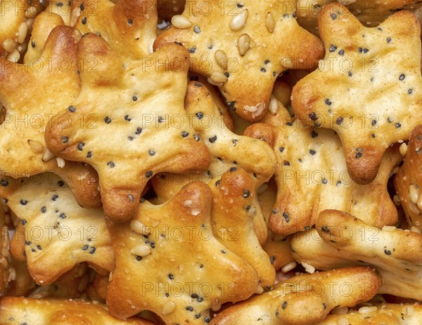 Full frame closeupof some baked crisp salty snack pieces