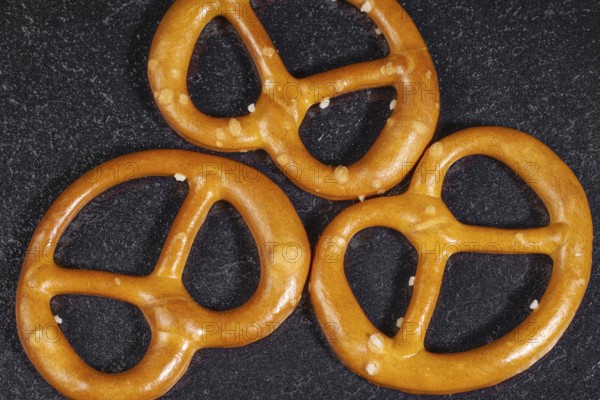Closeup of some lye pretzels in dark back