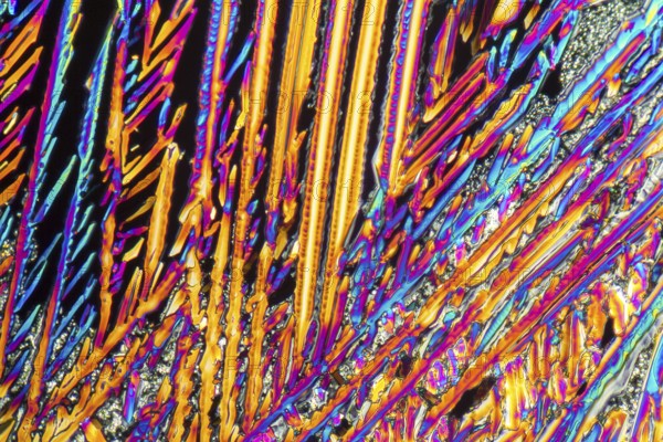 Colorful microscopic shot of Sodium nitrate microcrystals in polarized light