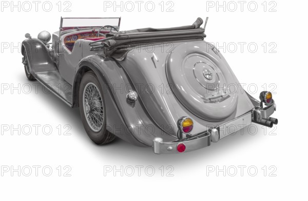 Rear view of a classic car isolated in white back with shadow