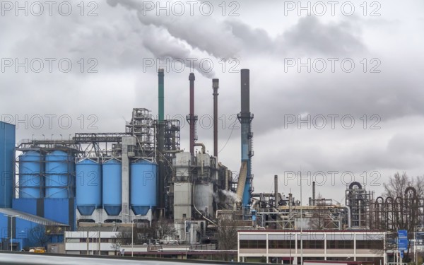 Industrial roadside scenery including a fabric and refinery
