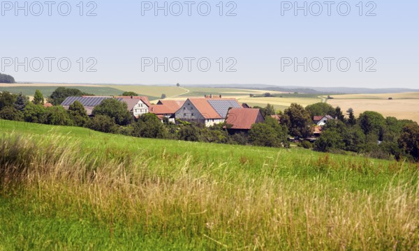 Small rural village in Southern Germany at summer time in agricultural ambiance
