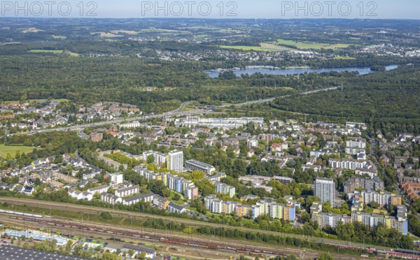 Aerial view, residential area district Hassels with high-rise buildings and view to Unterbacher See, Hasseler Forst and motorway A46 with triangle Düsseldorf-Süd, Hassels, Düsseldorf, Ruhr area, North Rhine-Westphalia, Germany, DE, Europe, aerial view, aerial photography, aerial photography, overview, bird's-eye view, overview