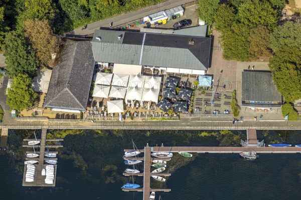 Aerial view, Se (h) restaurant at the boat harbour, outdoor gastronomy with deckchairs, benches and parasols, sailing boats at a jetty on the Unterbacher See at the campsite north, Unterbach, Düsseldorf, Ruhr area, North Rhine-Westphalia, Germany, outdoor gastronomy, beer garden, boats, café, DE, food and drink, Europe, inn, restaurant, gastronomy, aerial view, aerial photography, aerial photography, restaurant, parasols, overview, bird's-eye view, overview