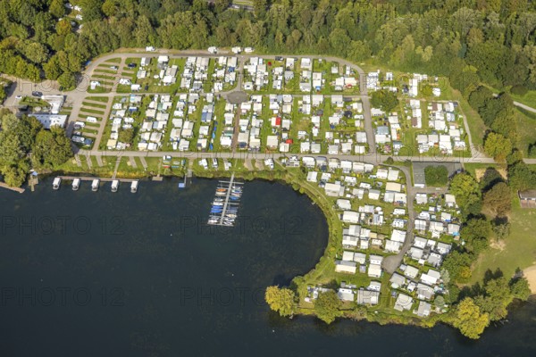 Aerial view, camping site at Unterbacher See, Unterbach, Düsseldorf, Ruhr area, North Rhine-Westphalia, Germany, motorway, railway tracks, camping, camping site, camping houses, camping site, DE, Europe, leisure, green trees, hobby, landscape, landscape forms, aerial view, aerial photography, aerial photography, lake, road traffic, overview, bird's eye view, caravan, birds-eyes view, green lung, overview