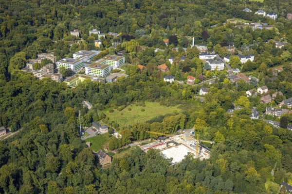 Aerial view, LVR Klinikum Düsseldorf für Psychiatrie und Psychotherapie, Kliniken der Heinrich-Heine-Universität Düsseldorf, construction site and new building with construction crane Auf der Hardt, Ludenberg, Düsseldorf, Ruhr area, North Rhine-Westphalia, Germany, construction work, construction area, construction site, building plots, construction, construction project, construction site, DE, Europe, healthcare, hospital, clinic, clinic centre, hospital, aerial view, aerial photography, aerial photography, medical facility, medical aid, new building, overview, bird's-eye view, overview, medical care
