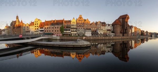 Panorama of the waterfront promenade with reflection at sunrise in the Old Town, Motlawa River, Gdansk, Gdansk, Poland