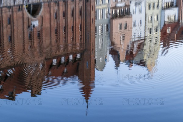 Waterfront promenade with reflection at sunrise in the Old Town, Motlawa River, Gdansk, Gdansk, Poland