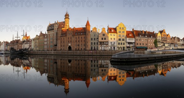 Panorama of the waterfront promenade with reflection at sunrise in the Old Town, Motlawa River, Gdansk, Gdansk, Poland