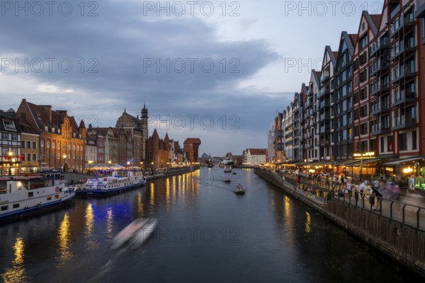 Illuminated promenade at sunset in the Old Town, Motlawa River, Gdansk, Poland