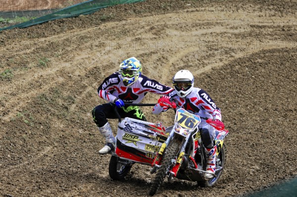 Motocross, Rudersberg, Baden-Württemberg, Germany, Europe, Rider with sidecar riding through an earthy bend, both in full gear, Rudersberg Motocross