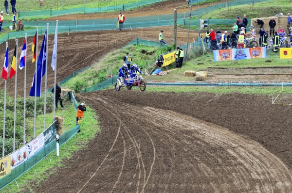 Motocross, Rudersberg, Baden-Württemberg, Germany, Europe, Motocross riders move around a winding track, watched by spectators and staff, Rudersberg Motocross