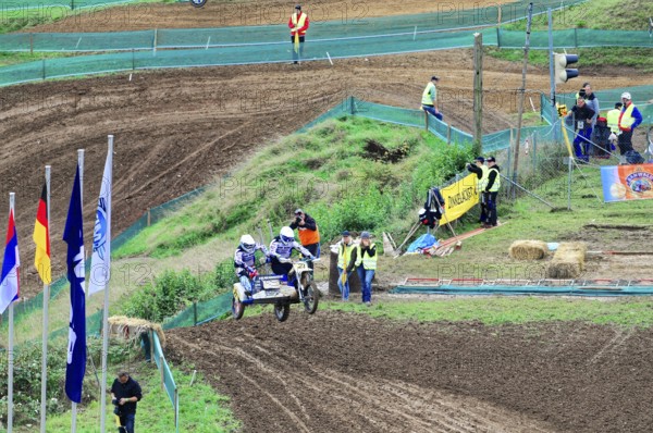 Motocross, Rudersberg, Baden-Württemberg, Germany, Europe, Motorcyclists with sidecars race on a muddy track surrounded by spectators, Rudersberg Motocross
