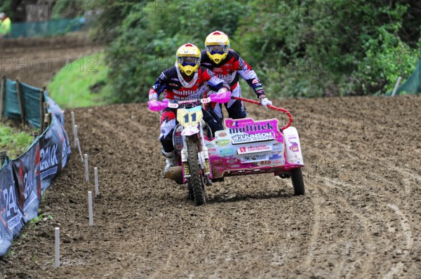 Motocross, Rudersberg, Baden-Württemberg, Germany, Europe, Two riders on a sidecar motorbike race over a muddy off-road track, Rudersberg Motocross