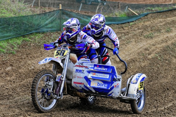 Motocross, Rudersberg, Baden-Württemberg, Germany, Europe, Two riders travelling fast over a muddy race track with sidecars, Rudersberg motocross