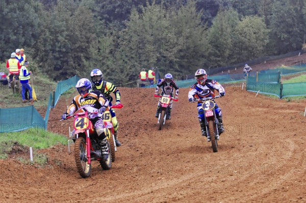 Motocross, Rudersberg, Baden-Württemberg, Germany, Europe, Group of motocross riders at a race in the forest, Rudersberg motocross