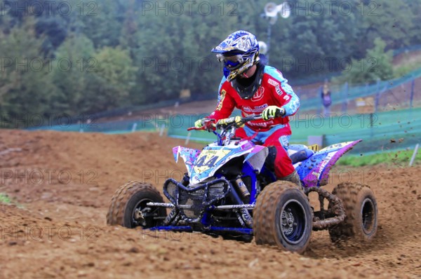 Motocross, Rudersberg, Baden-Württemberg, Germany, Europe, Quad rider in red outfit on a muddy race track, Rudersberg motocross