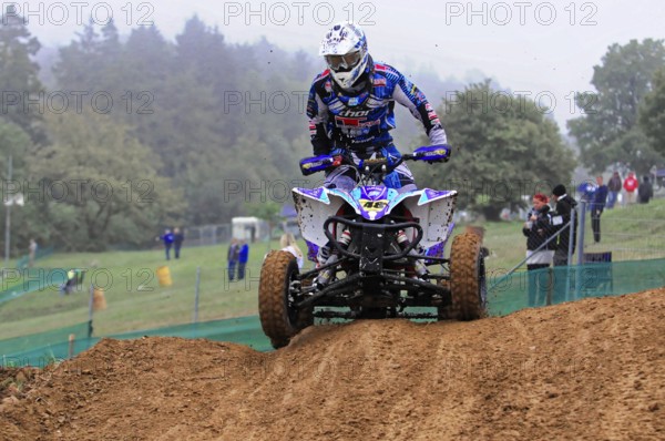 Motocross, Rudersberg, Baden-Württemberg, Germany, Europe, quad bikers in a mud race on a hilly course, Rudersberg motocross