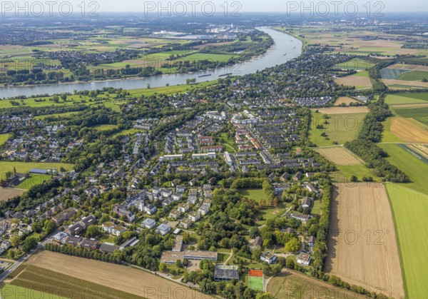 Aerial view, residential area district Wittlaer at the river Rhine, surrounded by meadows and fields, housing estate and three-winged house, former children's home at Bergesweg, Wittlaer, Düsseldorf, Ruhr area, North Rhine-Westphalia, Germany, DE, Europe, property tax, real estate, aerial view, aerial photography, aerial photography, overview, bird's eye view, residential area, living and life, residential area, residential quality, residential neighbourhood, housing estate, residential district, birds-eyes view, overview