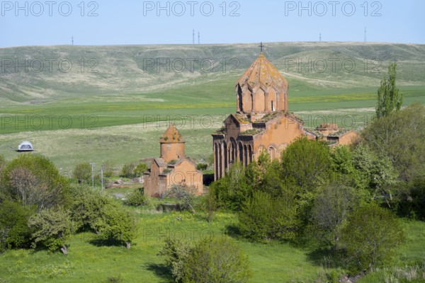 Historic church in the middle of a green landscape with hills and clear skies, Marmashen Monastery, Marmashen Vank, Shirak Province, Armenia