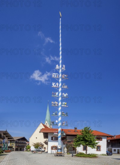 Parish Church of the Assumption of the Virgin Mary with maypole and town hall on the village square, Törwang, Samerberg, Chiemgau, Upper Bavaria, Bavaria, Germany