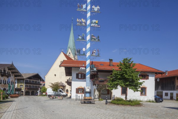 Parish Church of the Assumption of the Virgin Mary with maypole and town hall on the village square, Törwang, Samerberg, Chiemgau, Upper Bavaria, Bavaria, Germany