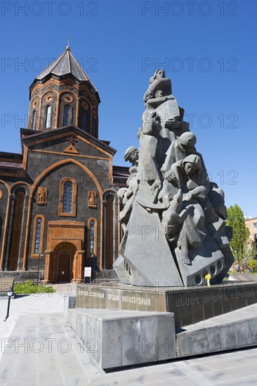 A stone monument in front of a church with classical architecture under a clear sky, Church of the Holy Saviour, Church of the Saviour and monument to the victims of the earthquake in Spitak, Gyumri, Gyumri, Shirak Province, Armenia