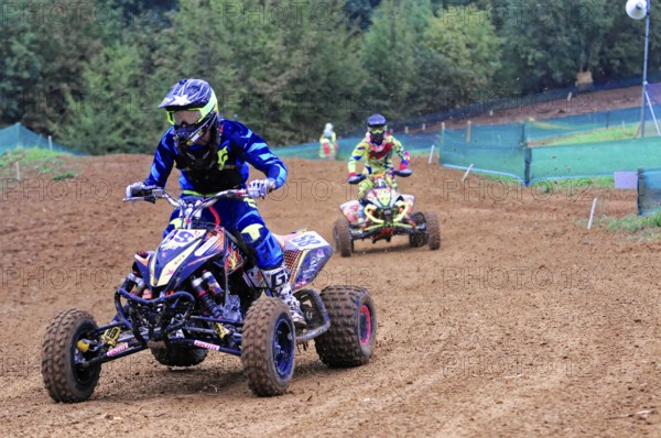 Motocross, Rudersberg, Baden-Württemberg, Germany, Europe, Two quad riders in full action during an off-road race on muddy ground, Rudersberg Motocross