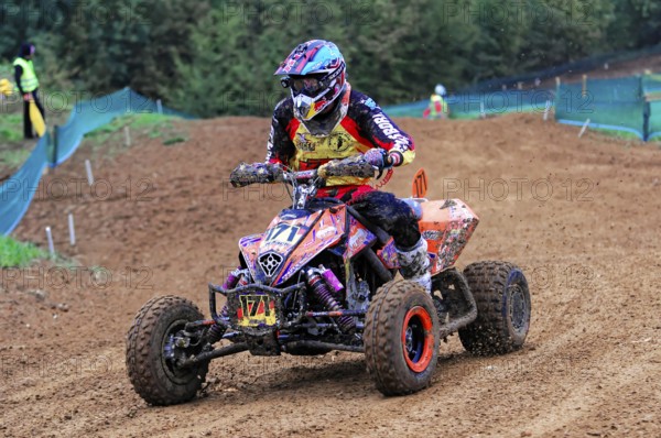 Motocross, Rudersberg, Baden-Württemberg, Germany, Europe, A quad rider masters the bend in the off-road race in full protective clothing, Rudersberg motocross