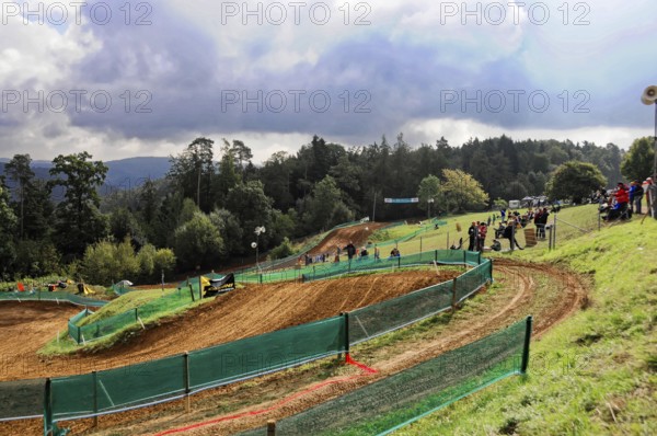Motocross, Rudersberg, Baden-Württemberg, Germany, Europe, A winding race track in hilly terrain under a cloudy sky with spectators, Rudersberg Motocross