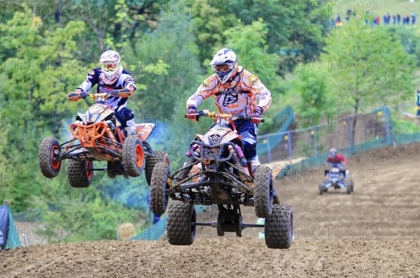 Motocross, Rudersberg, Baden-Württemberg, Germany, Europe, Two quad bikers jump side by side over a track in a sporting competition, Rudersberg motocross