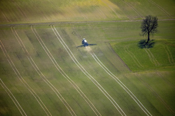 Aerial view, slurry tractor on a field during slurry spraying, emission, in Lichtenfels in Hesse. Lichtenfels, North Hesse, Hesse, Germany, Lichtenfels, DEU, Europe, birds-eyes view, aerial view, aerial photography, aerial photography, overview, overview, bird's eye view