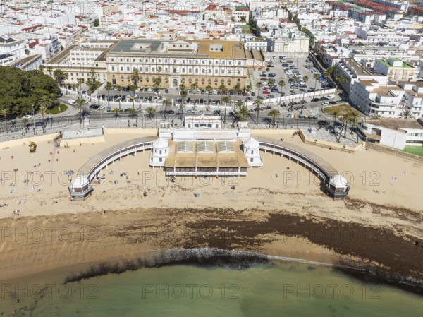 Partial view of the old quarter of the town of Cádiz. Prominent the Caleta beach and the old Balneario de la Palma. Aerial view. Drone shot. Cádiz province, Andalusia, Spain