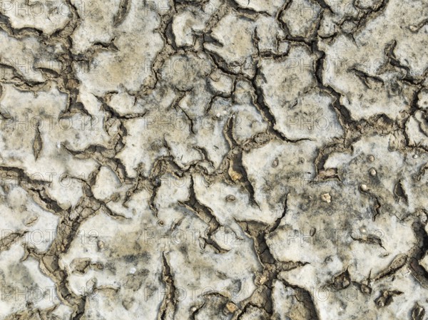 Dried mud in the marshland of the Bahía de Cádiz Nature Reserve. Aerial view. Drone shot. Cádiz province, Andalusia, Spain