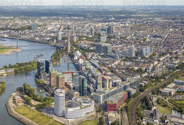 Aerial view, Media Harbour at the river Rhine, Rhine Tower and Rheinknie Bridge, in front construction site with construction crane and new Uniq Towers between Kaistraße and Zollhof, view over Düsseldorf City with Old Town, harbour, Düsseldorf, Ruhr area, North Rhine-Westphalia, Germany, Old Town, construction work, construction area, construction site, building plots, construction, construction project, construction site, bridge, DE, Europe, commercial enterprise, commercial space, commercial area, commercial property, commercial location, commercial use, industrial area, industrial location, aerial view, aerial photography, aerial photography, new building, tower, overview, bird's eye view, birds-eyes view, overview