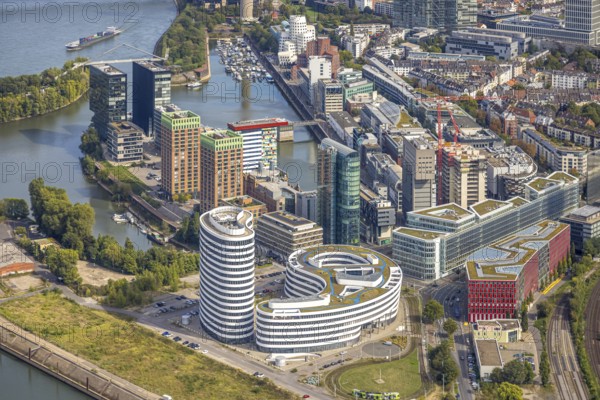 Aerial view, Media harbour on the river Rhine, construction site with construction crane and new Uniq Towers between Kaistraße and Zollhof, harbour, Düsseldorf, Ruhr area, North Rhine-Westphalia, Germany, construction work, construction area, construction site, building plots, construction project, construction site, DE, Europe, commercial enterprise, commercial area, commercial area, commercial property, commercial site, commercial use, industrial area, industrial site, aerial photograph, aerial photography, aerial photography, media centre, new building, overview, bird's-eye view, birds-eyes view, overview