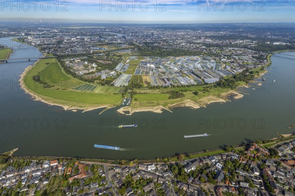 Aerial view, Rhine bend and district Volmerswerth, horticultural farms and agricultural use in the district Volmerswerth, shapes and colours with graphical representation, river Rhine and inland navigation, distant view and blue sky with clouds, Volmerswerth, Düsseldorf, Ruhr area, North Rhine-Westphalia, Germany, DE, Europe, river, aerial view, aerial photography, aerial photography, navigation, overview, bird's-eye view, overview