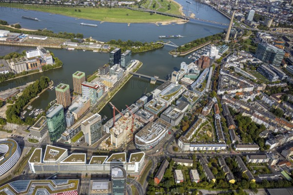 Aerial view, Media Harbour office and business district, view to the river Rhine and Rhine Tower, construction site with construction crane and new building Uniq Towers between Kaistraße and Zollhof, harbour, Düsseldorf, Ruhr area, North Rhine-Westphalia, Germany, construction work, construction area, construction site, building plots, construction crane, construction measure, construction project, construction site, DE, Europe, aerial view, aerial photography, aerial photography, Media Harbour, new building, tower, overview, bird's-eye view, bird's-eye view, overview