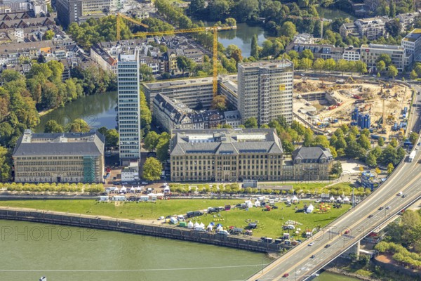 Aerial view, event with pavilions on the meadow at the State Chancellery next to the Rheinkniebrücke, on the right construction site Haroldstraße, demolition of the former Ministry of the Interior and planned new administrative centre for the state administration of North Rhine-Westphalia, Carlstadt, Düsseldorf, Ruhr area, North Rhine-Westphalia, Germany, Apollo-Platz, construction work, construction area, building site, building plots, construction project, building site, authority, Bernhard Paul organiser, DE, Europe, events, culture, art, aerial photography, aerial photography, new building, theatre, overview, event centre, bird's eye view, birds-eyes view, cultural use, overview