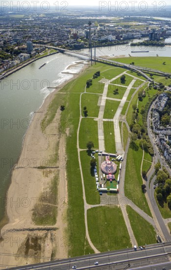 Aerial view, Rhine meadows Oberkassel with circus tent Waterland, behind the Rhine knee bridge over the river Rhine, Oberkassel, Düsseldorf, Ruhr area, North Rhine-Westphalia, Germany, DE, Europe, aerial view, aerial photography, aerial photography, overview, bird's eye view, circus, birds-eyes view, overview