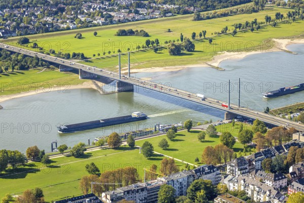 Aerial view, Theodor-Heuss-Bridge and inland navigation on the river Rhine, in front Rheinpark Golzheim, behind Niederkasseler Deich, Niederkassel, Düsseldorf, Ruhr area, North Rhine-Westphalia, Germany, inland navigation, bridge, DE, Europe, river, aerial view, aerial photography, aerial photography, road traffic, overview, bird's-eye view, overview