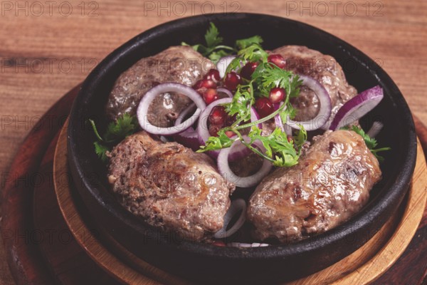 Fried apkhazura, cutlet in a fat grid, spicy, Georgian dish, fried on ketsi, homemade, no people