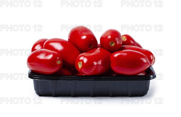 Plum-shaped tomatoes, fresh, in a black plastic container, on a white background, isolate