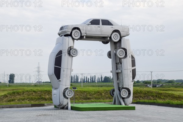 Homemade sculpture of three cars. Monument to the cyrillic letter P. Public Monument. Krasnodar, Russia