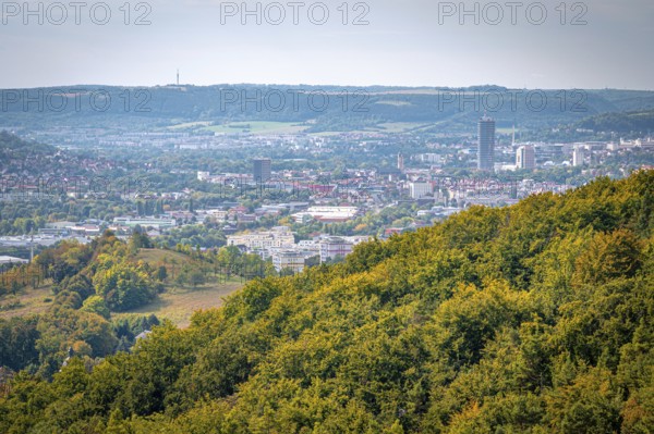 View of Jena city centre with the Jentower skyscraper, surrounded by forests and mountains, Jena, Thuringia, Germany