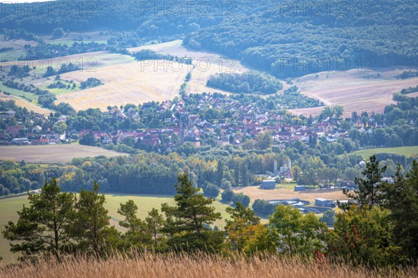 Small village of Kunitz in a hilly landscape with fields and forests, Jena, Thuringia, Germany