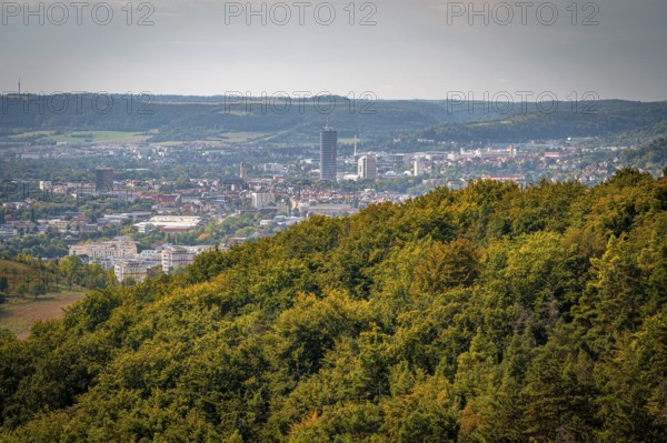 Jena city centre with a striking high-rise building Jentower, surrounded by forests under a grey sky, Jena, Thuringia, Germany