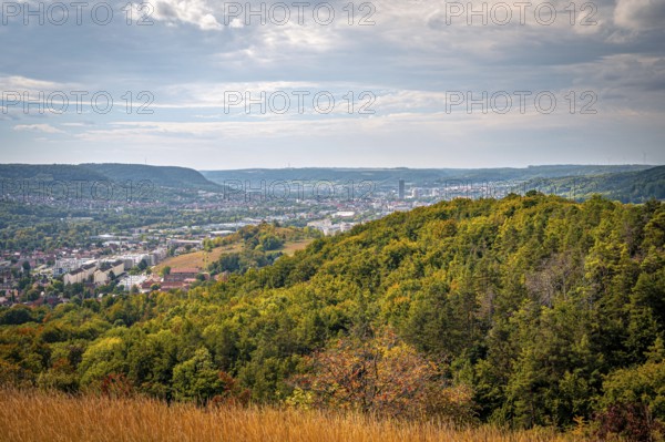 View over wooded hills to the city centre of Jena, partly cloudy sky, Jena, Thuringia, Germany