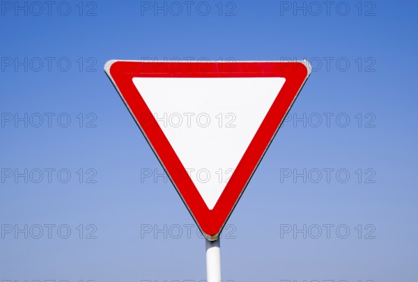 Road signs, give way. Sign on a blue background. Krasnodar, Russia